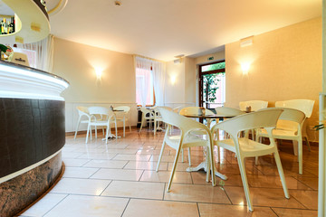 Hotel and breakfast restaurant interior on background architecture
