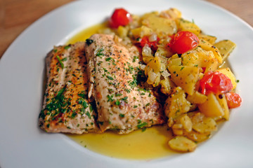 healthy and fresh cooking at home - salmon fillet with potatoes in olive oil