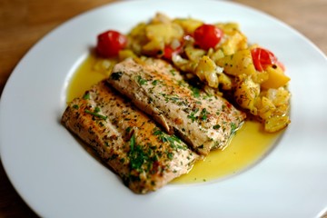 healthy and fresh cooking at home - salmon fillet with potatoes in olive oil