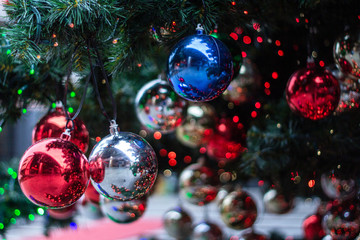 Christmas ornaments on the Christmas tree with bokeh background