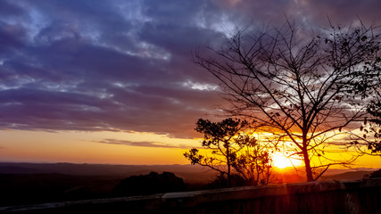 Fototapeta na wymiar Sunset with trees silhouette in lookout of Serra do Cipo National Park, Minas Gerais, Brazil
