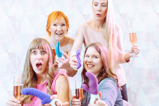 Women showing sex toys they bought at a dildo party