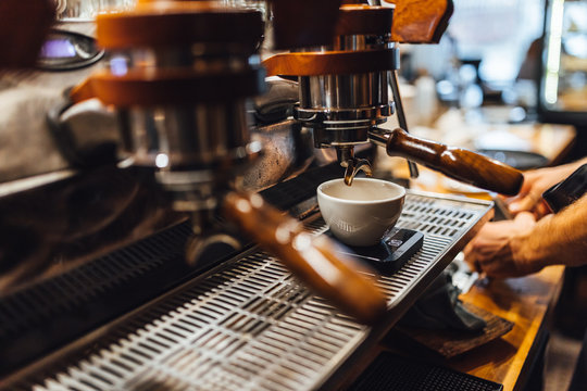 Espresso machine in close up, barista making coffee