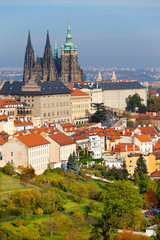 Obraz premium Autumn Prague City with gothic Castle and colorful Nature and Trees from the Hill Petrin, Czech Republic