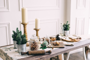 Christmas composition with nuts and candlesticks