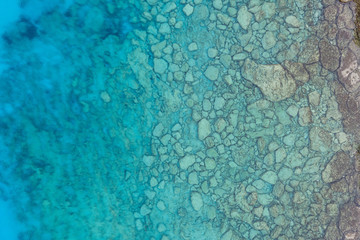 An aerial view of the beautiful Mediterranean sea, where you can se the rocky textured underwater...
