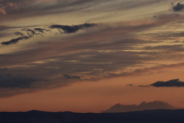 sunsets with stunning colors and delicate clouds