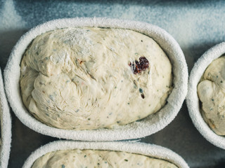 baskets of bread with bread dough