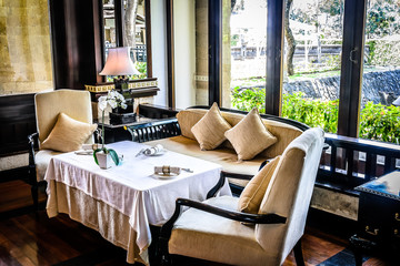 beautiful restaurant with white linen table cloths, white linen napkins and mother of pearl napkin holders