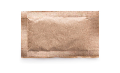 Brown sugar packet on white