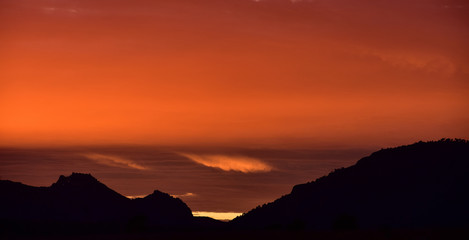 sunsets with stunning colors and delicate clouds