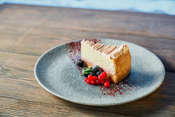 Traditional cheesecake served with berries.