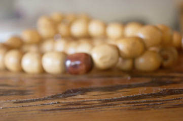 close-up of wooden chain on rustic table