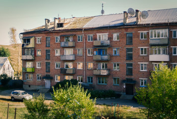 Fototapeta na wymiar Soviet architecture. Ust-Kamenogorsk (Kazakhstan). Apartment building. Soviet architectural style. Typical socialist apartment building. Apartment block
