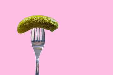 Pickle on fork, dill, gherkin, pink background, national pickle day	 - obrazy, fototapety, plakaty