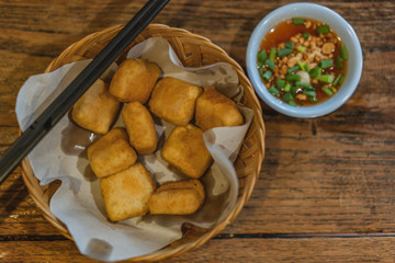 Stir Fried Japan Tofu in a bowl with sweet sauce.