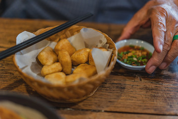 Stir Fried Japan Tofu in a bowl with sweet sauce.
