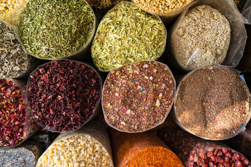 Bags of colorful spices at market in Dubai, United Arab Emirates