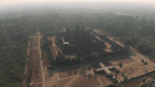 Angkor Wat Temple in Cambodia sunrise fog drone flight