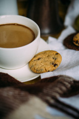 Cozy home weekend arrangement, warm bedroom decorations with coffee, wool blanket