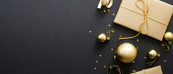 christmas banner with gold balls and gift boxes on black background