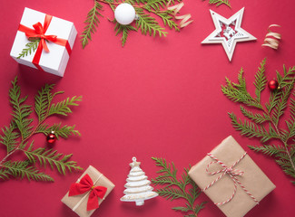 New Year Christmas presents flat lay top view on red background. Top view