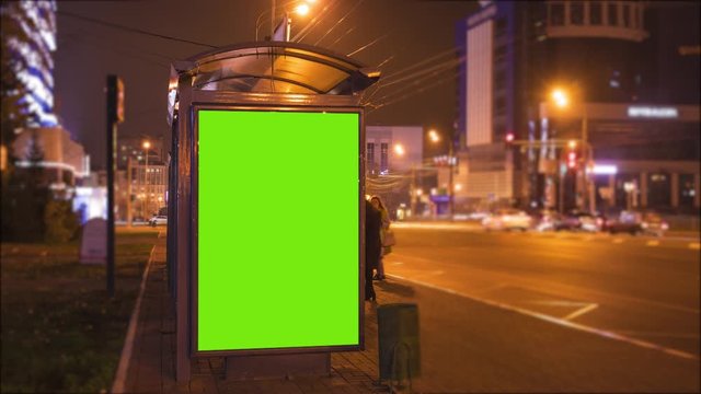 billboard with a chroma key green screen on a traffic cars