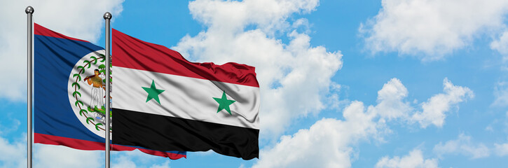 Belize and Syria flag waving in the wind against white cloudy blue sky together. Diplomacy concept,...
