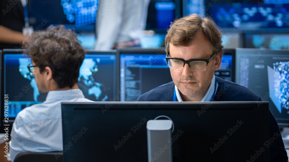Poster Neural Network Algorithm Architect Working at His Workstation in a Busy Creative Office. Multi-Ethnic Team Works with Multiple Screens Showing AI, Data Mining, Machine Learning Processes.