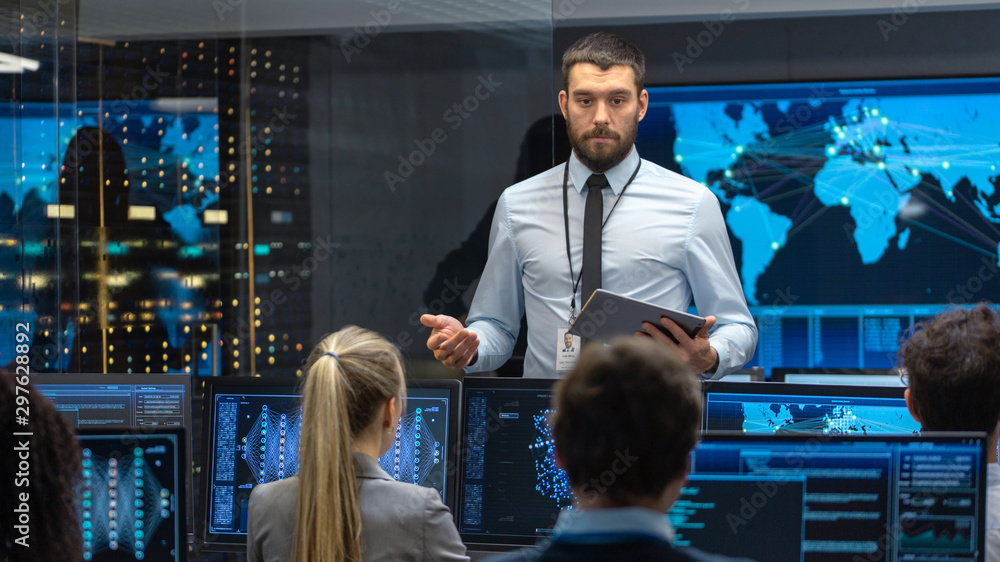 Poster Chief Project Engineer Holds Briefing for a Team of Scientists that are Building Machine Learning System. Displays Show Working Model of Neural Network. 