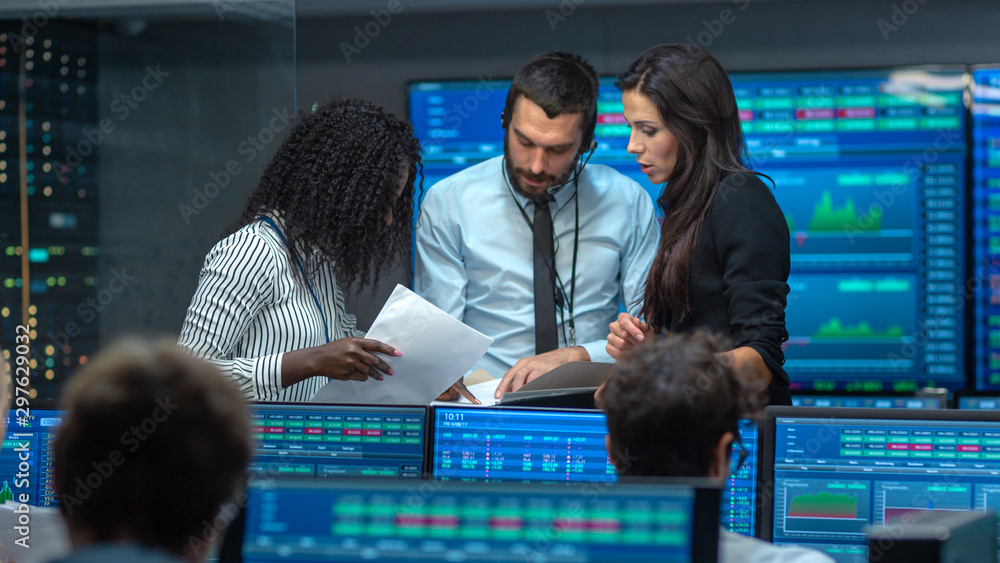 Poster multi-ethnic team of traders is busy working at the stock exchange office. dealers and brokers buy a