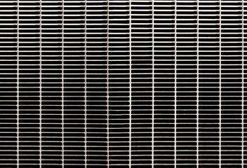 Detail of a metal grate for water runoff. Useful for textures and patterns.