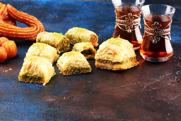 Baklava on table. Middle eastern or arabic dishes. Turkish Dessert Baklava with pistachio on rustic...