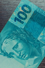 Closeup at 100 bill Brazilian money. Economy of Brazil concept image.