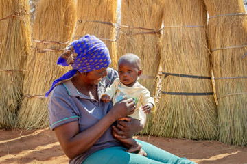 African woman carry child
