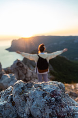 Obraz premium Woman on a rock