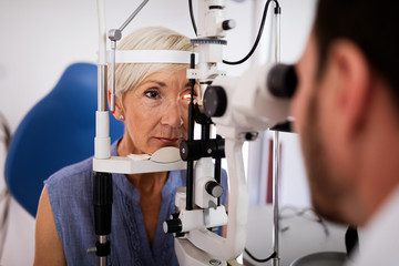 Ophthalmology concept. Patient eye vision examination in ophthalmological clinic - obrazy, fototapety, plakaty