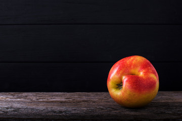 Close-up two ugly red apples on grey concrete background.