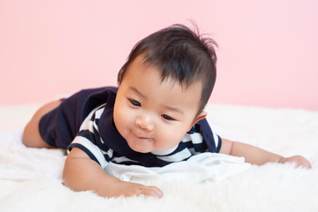 Happy newborn cute baby in studio