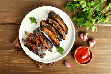 Grilled pork ribs on white plate