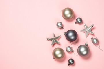Christmas flat lay background on pink with decorations.