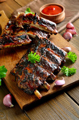 Grilled pork ribs on cutting board