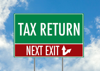 Next exit for tax return green road sign over blue sky background. Concept road sign collection.
