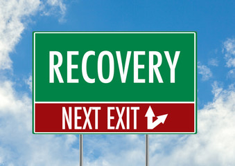 Next exit for recovery green road sign over blue sky background. Concept road sign collection.