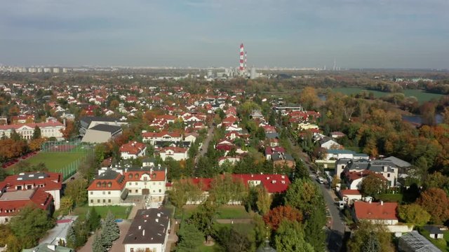 Drone shot at cottage ryan Vilanow Warsaw. Aerial view on the roofs of ancient buildings in a suburb of Warsaw. Poland. Drone Shot 4K. 