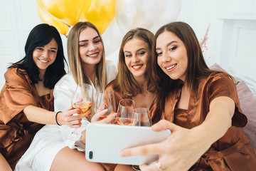 Bachelorette Weekend. bridesmaids making selfie and fun photo, have a cool party with alcohol