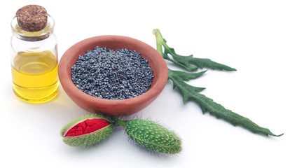 Poppy flower seeds and extract in a bottle