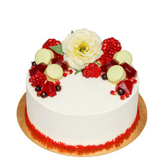 Red velvet cake with chocolate flower decoration pomegranate and macaroons isolated on white