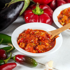 Chemen sauce in bowl with vegetables.
