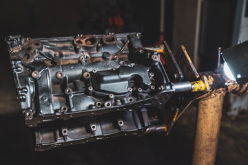 Internal combustion engine in a workshop, closeup. Repair service